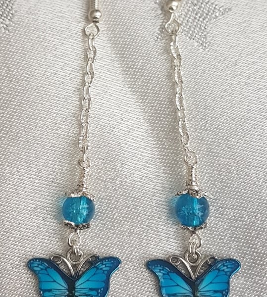 Gorgeous Dangly Blue Butterfly Earrings - Silver Tones.