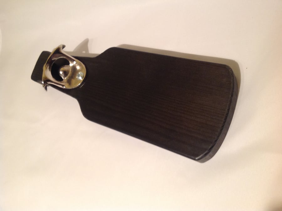 Wall mounted bottle opener