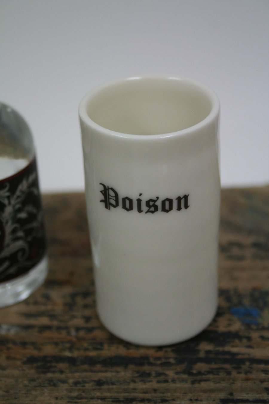 Porcelain shot 'glass' with poison wording