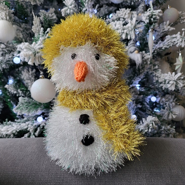 Snowman with gold hat and scarf hand knitted and perfect for Christmas