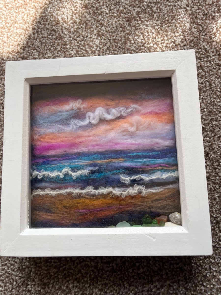 Pink sky sunset over the sea and beach Seaglass and shells white frame 