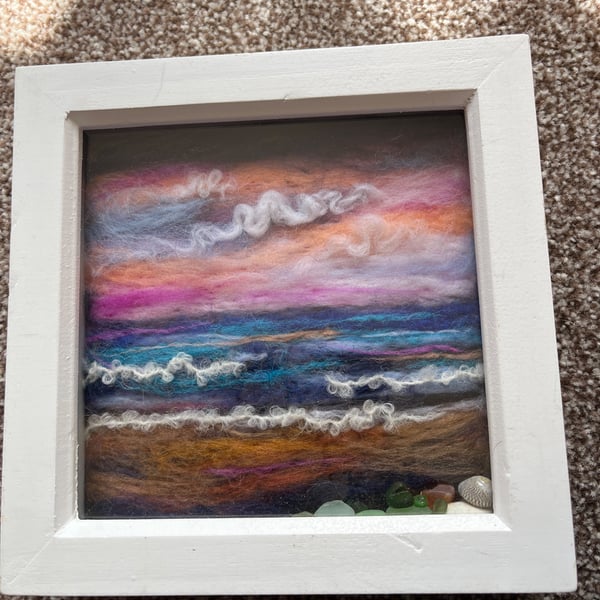 Pink sky sunset over the sea and beach Seaglass and shells white frame 