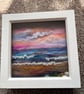 Pink sky sunset over the sea and beach Seaglass and shells white frame 