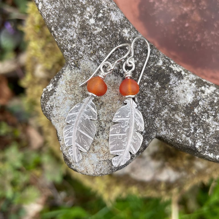 Silver and orange carnelian feather earrings