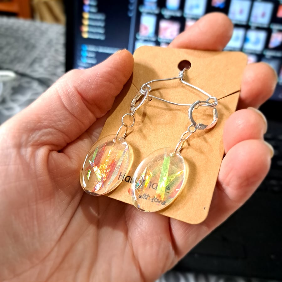 Super sparkly pair of oval resin earrings with dichroic film strips