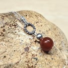 Small circle rope Red Carnelian pendant. July birthstone necklace.