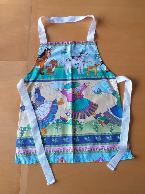 Old Woman who Swallowed a Fly, Apron, age 2-6 approximately