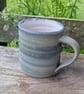 Hand-thrown, stoneware mug in "granite" glaze with a food-safe, stain-resistant,