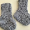 Hand knitted bootees