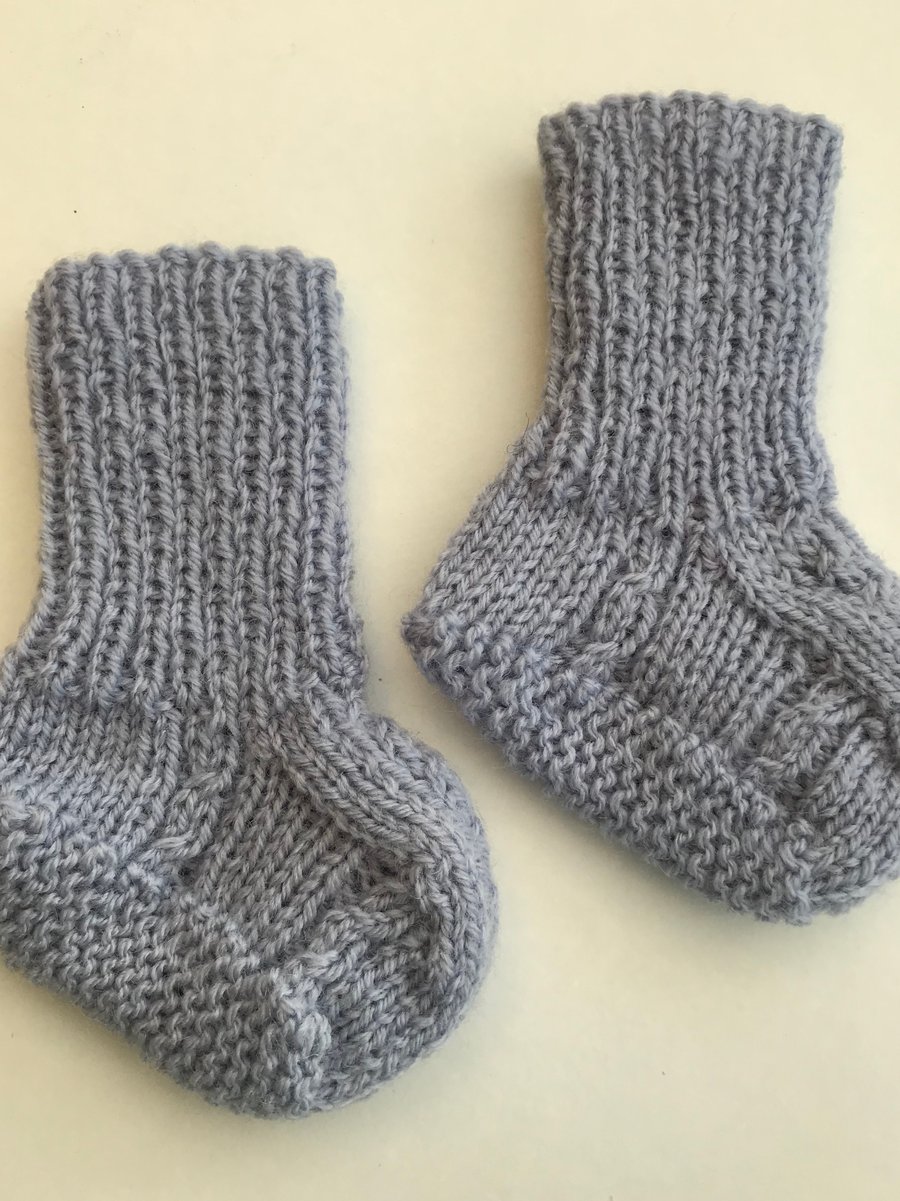 Hand knitted bootees