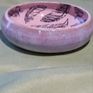 Circular pale pink trinket dish with feather details handmade pottery