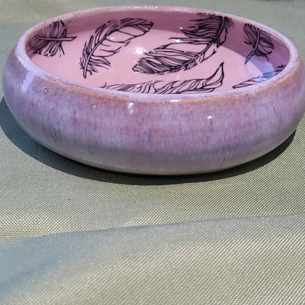 Circular pale pink trinket dish with feather details handmade pottery