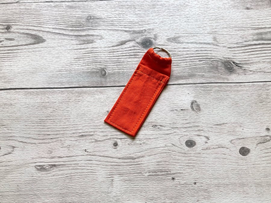 Orange colour lip balm holder. Cotton fabric lipstick keychain.