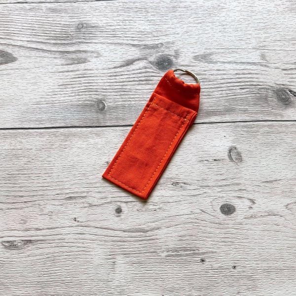 Orange colour lip balm holder. Cotton fabric lipstick keychain.