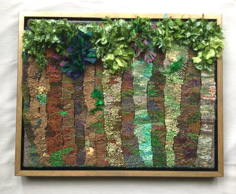 Framed handwoven tapestry weaving,  textile art in browns, greens and blues