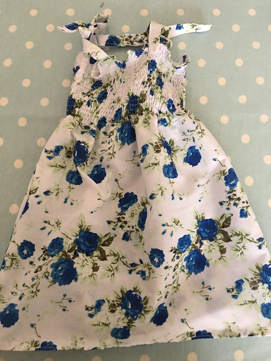 Aged 2-4 Smock style summer dress in  blue floral design cotton fabric  