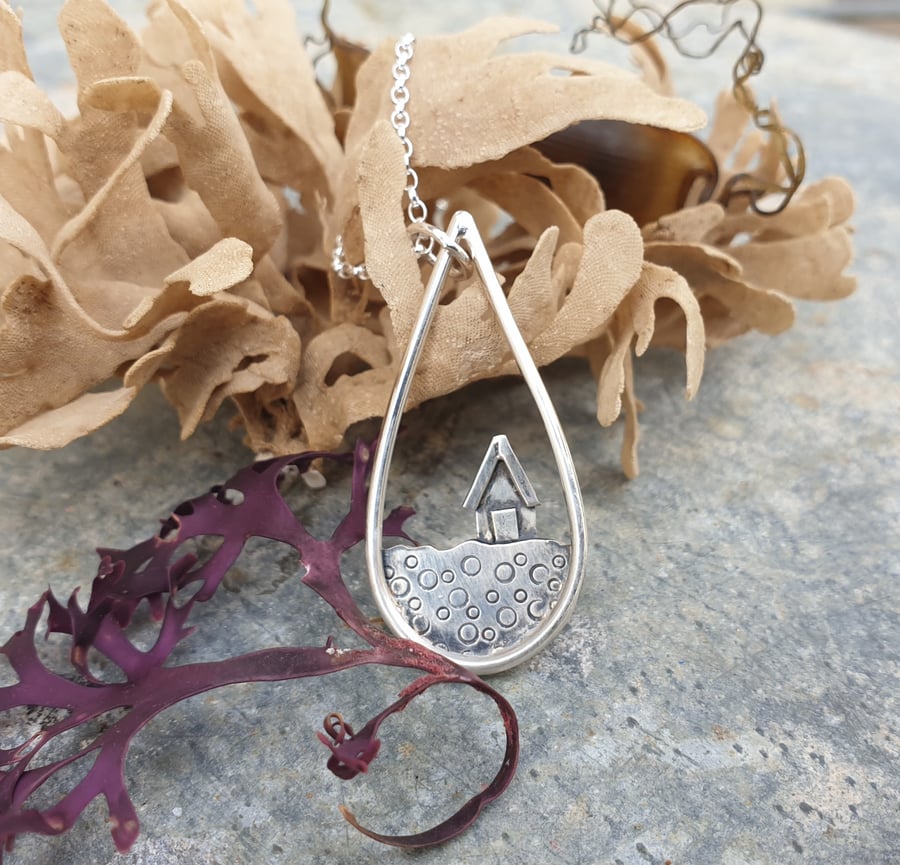 Silver teardrop beach pendant with beach hut