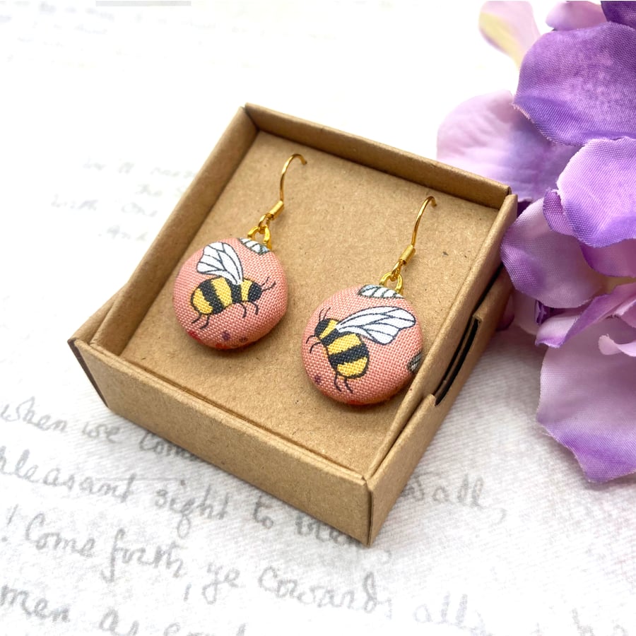 Bee fabric button earrings on pink background nature lovers