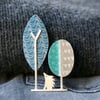 Hedgehog and trees brooch