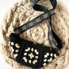 Crocheted black and cream granny square bumbag