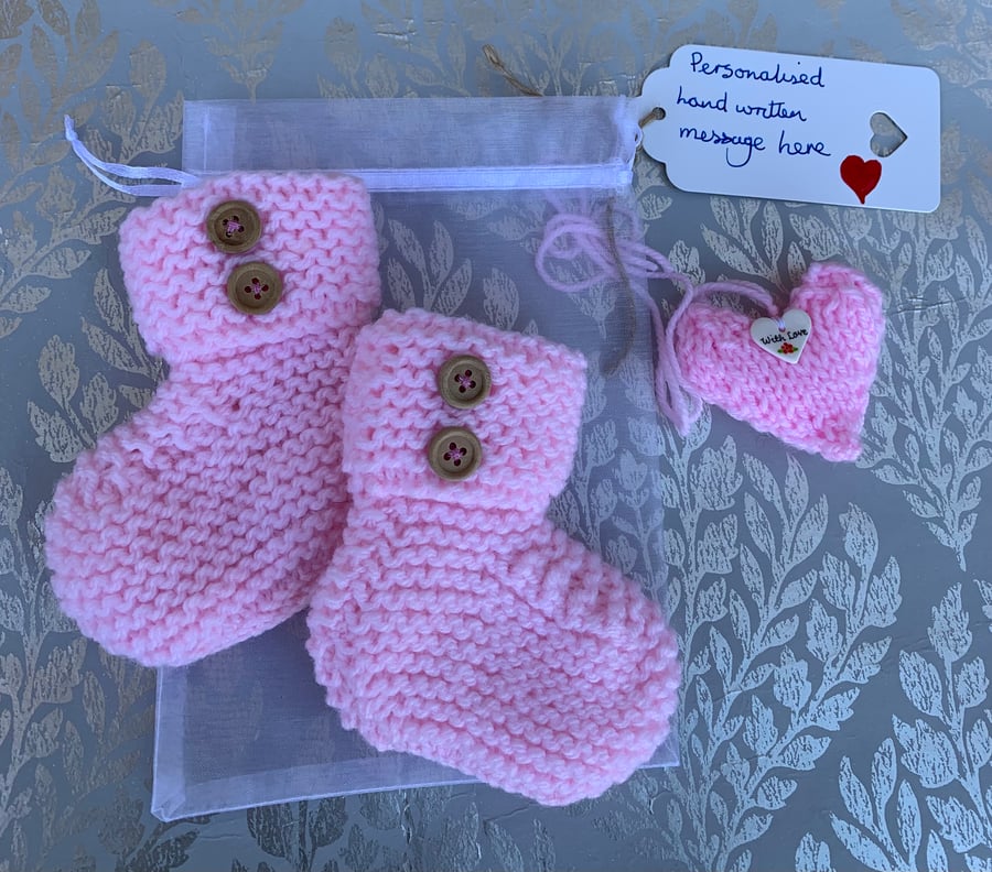  Pink baby bootees in a bag, 0-3 months with knitted heart
