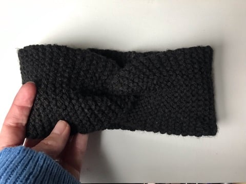 Hand knitted black wool ear warmers with a decorative twist