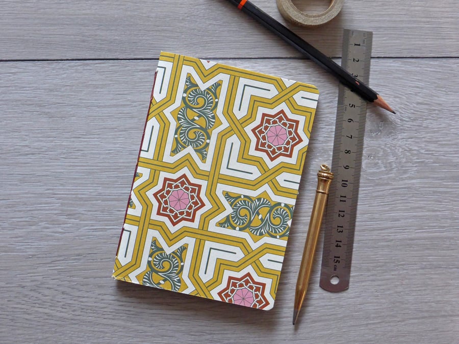 Handmade A6 notebook in with yellow and red patterned cover