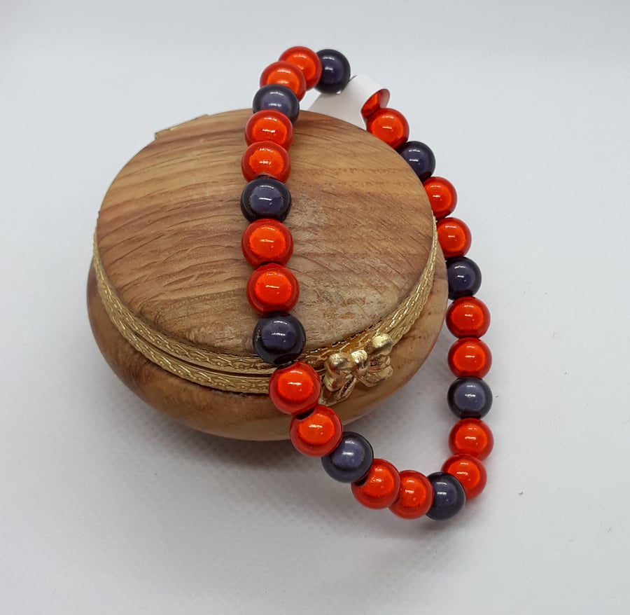 BR351 Orange and brown miracle bead bracelet