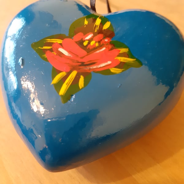 Bright blue heart shaped bauble with canal art style roses
