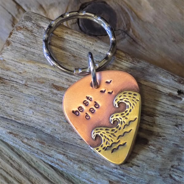 Copper and brass plectrum shaped 'ocean waves' fathers day keyring 