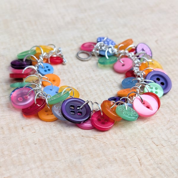 Dainty rainbow button bracelet on silver plated chain with toggle clasp 