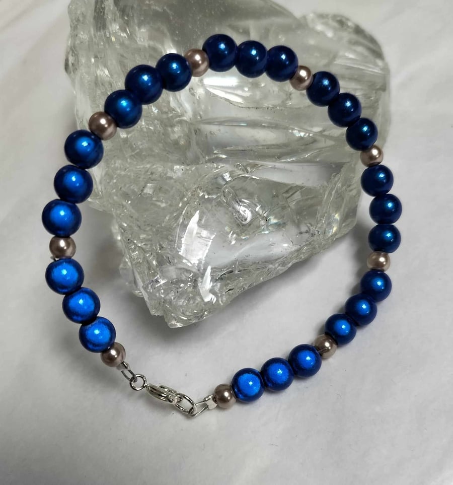 BR476 Blue miracle bead and champagne pearl bracelet