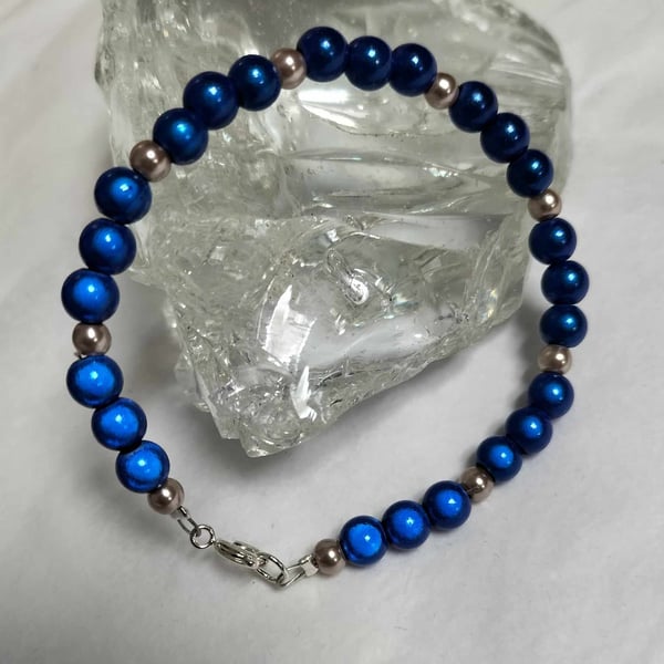 BR476 Blue miracle bead and champagne pearl bracelet