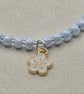 Pearl blue seed bead bracelet with small white flower charm - Image 3