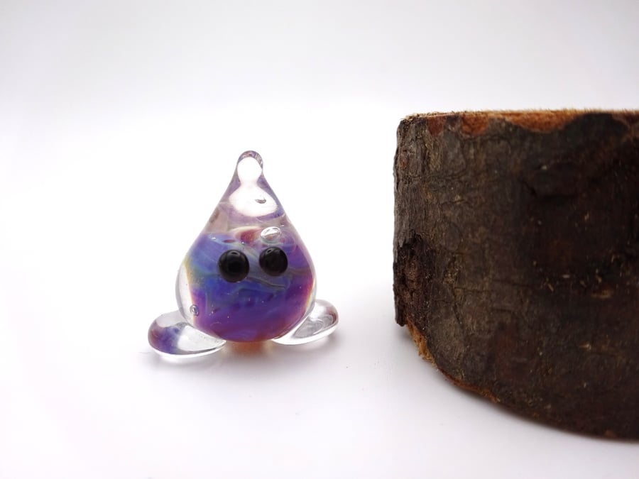 small glass wisp figure