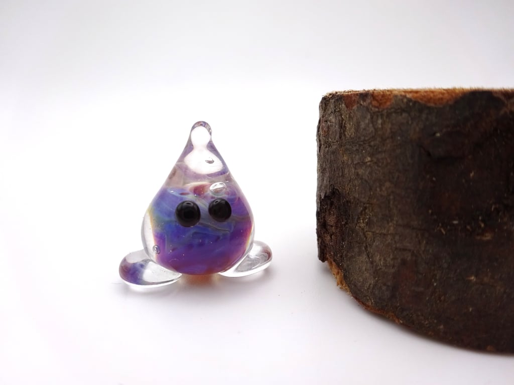small glass wisp figure