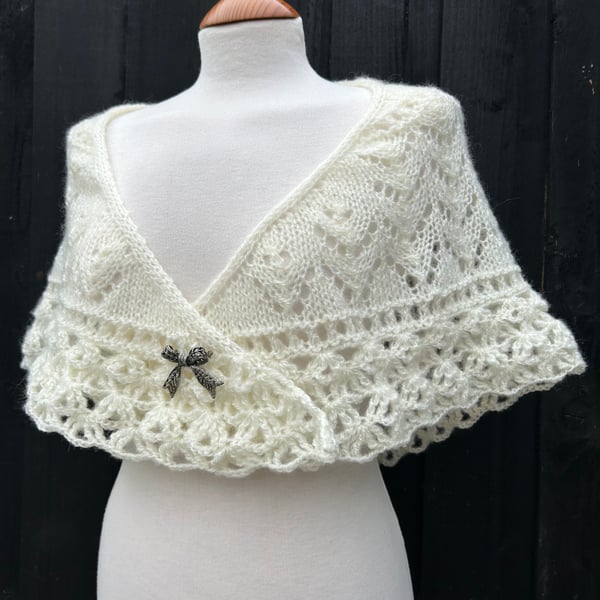 Hand knitted light cream shallow triangle lace shawl with crochet edging 
