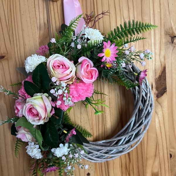 Pink wicker door wreath