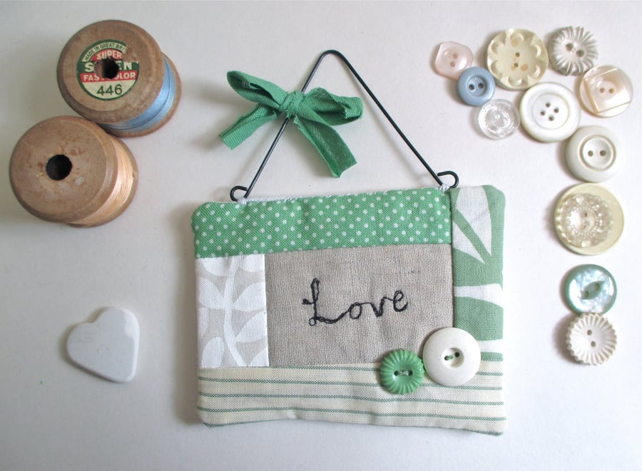 'Love' Hanging Quilted Fabric Quote with Button Decoration