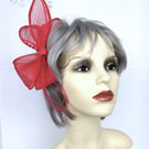 Fuchsia pink fascinator bow with feathers and beads