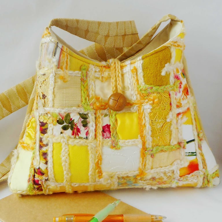 Pyramid shaped cross body shoulder bag in golden yellow