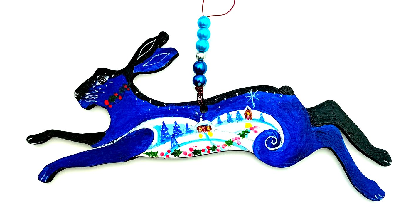 The Christmas hare with snow and holly