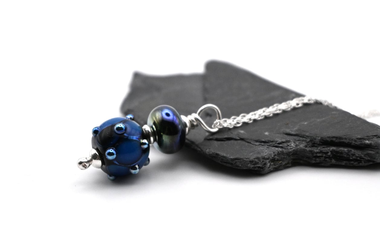 black and metallic blue bump pendant necklace