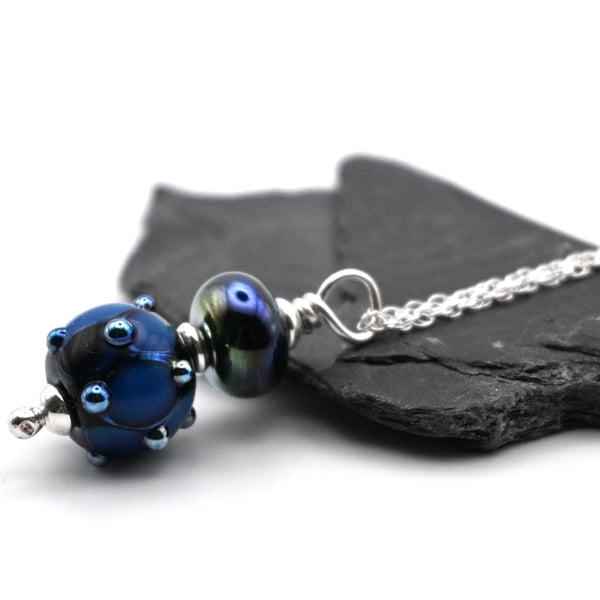black and metallic blue bump pendant necklace