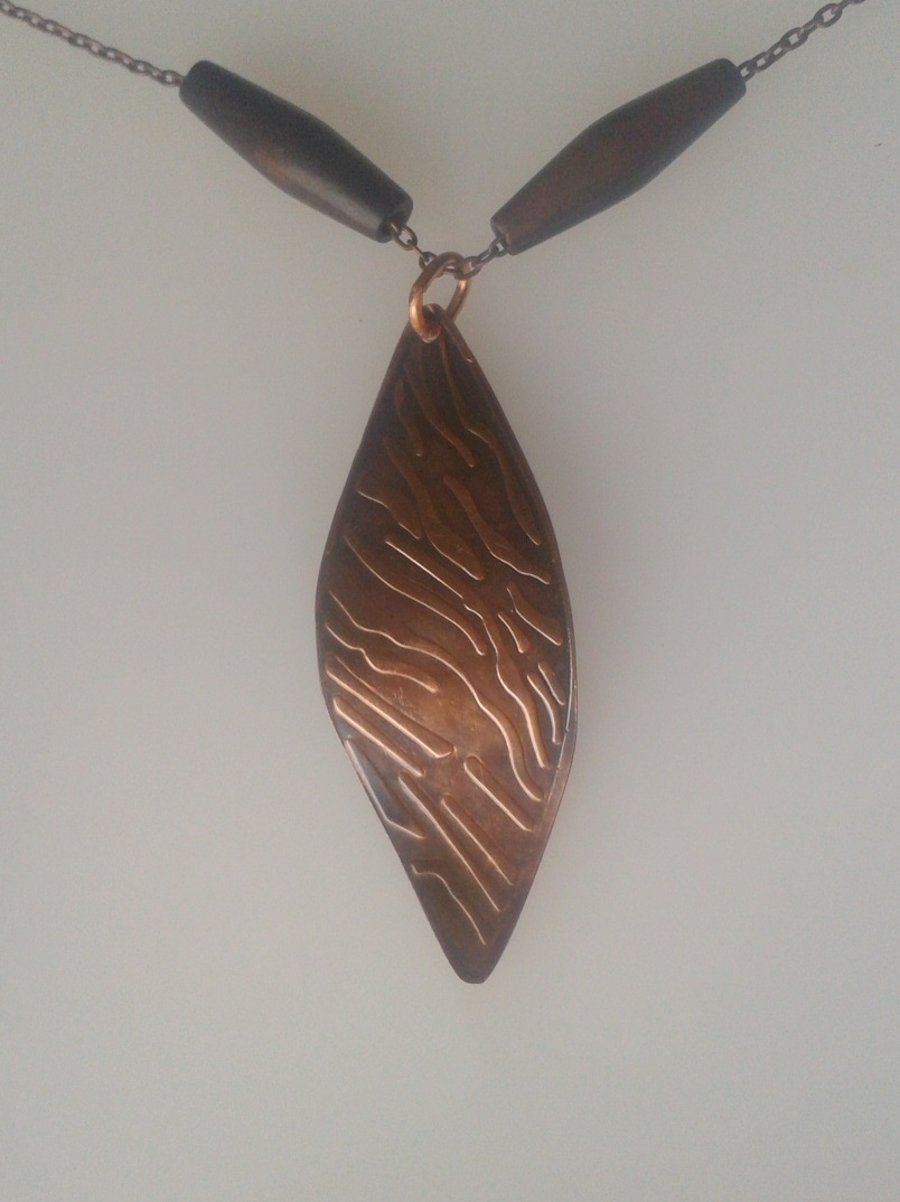 Copper leaf pendant imprinted with a tiger-striped pattern,  P47B