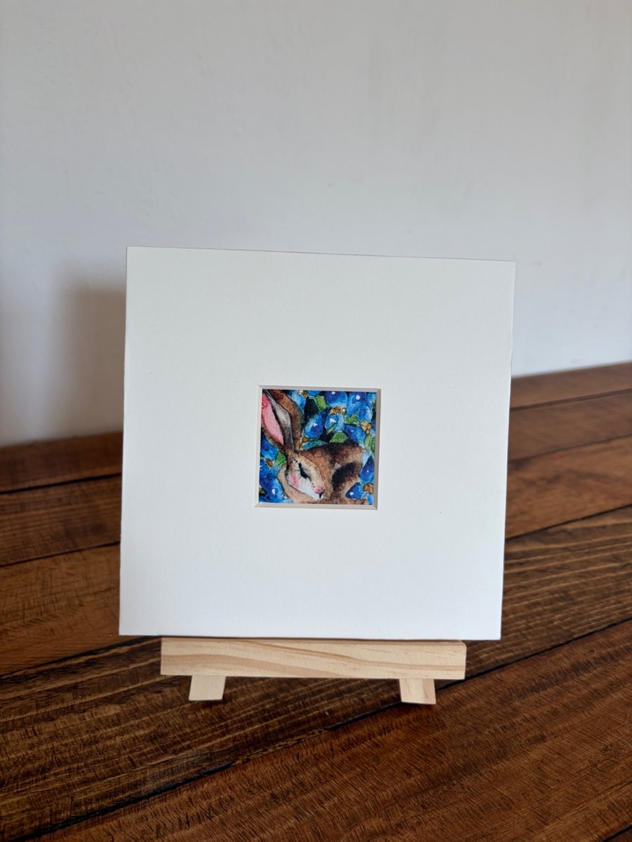 Image of Mounted Resting Whimsical Hare Rabbit with Blue Wildflowers Watercolour Print