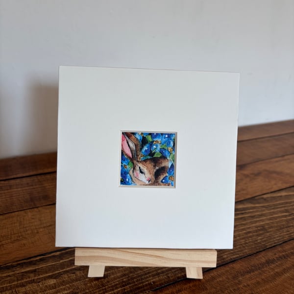 Mounted Resting Whimsical Hare Rabbit with Blue Wildflowers Watercolour Print