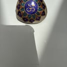 Hand painted om symbol on natural rock