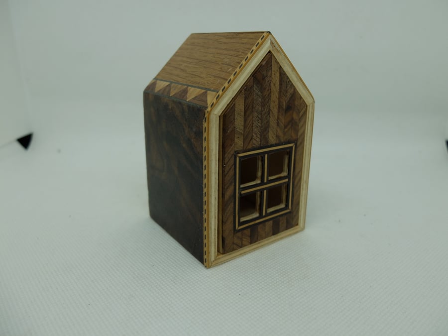 Small hand veneered house box with pull out drawer