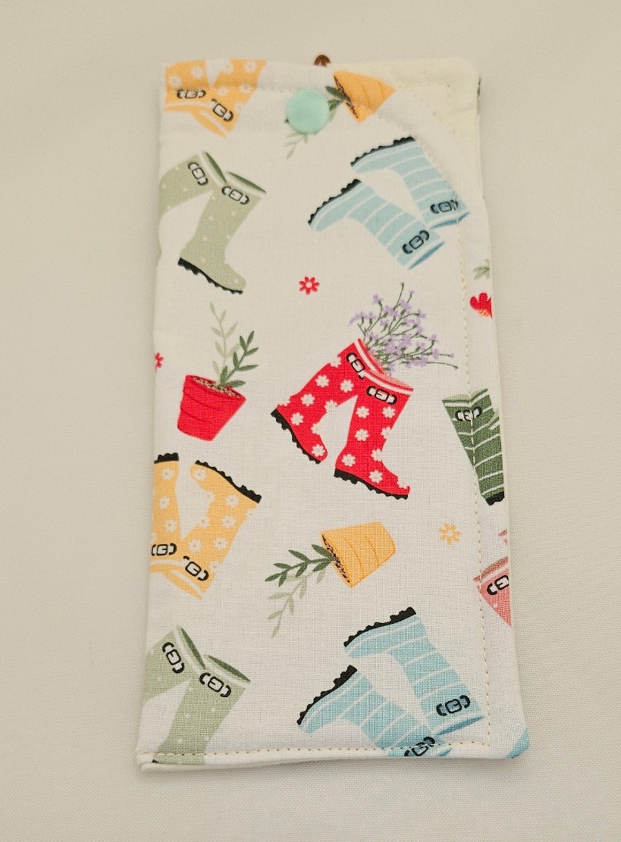 Wellingtons and garden themed cotton fabric glasses case.